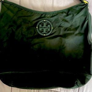 Tory Burch black canvas bag w/leather strap.Can be used over shoulder or on arm.